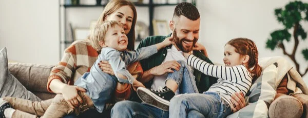 Image of a happy family for article how to get out of credit card debt without ruining your credit